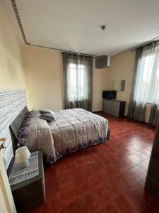 Ένα ή περισσότερα κρεβάτια σε δωμάτιο στο Casa Adelaide vicino al mare,uscita Ancona Sud