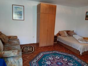 Postel nebo postele na pokoji v ubytování Pensiunea Sapte Pini