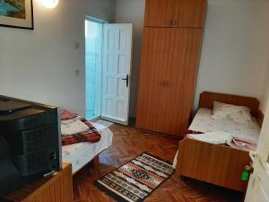 Postel nebo postele na pokoji v ubytování Pensiunea Sapte Pini