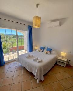 A bed or beds in a room at Villa PALMERA