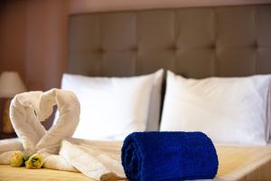 Postel nebo postele na pokoji v ubytování Villas Roumeli