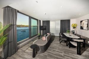 a living room with a view of the water at Pera Bosphorus Hotel in Istanbul