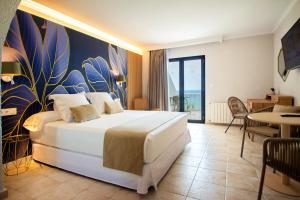 Postel nebo postele na pokoji v ubytování Hotel Servigroup Montíboli