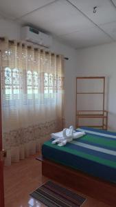 Posteľ alebo postele v izbe v ubytovaní Subhas Apartment