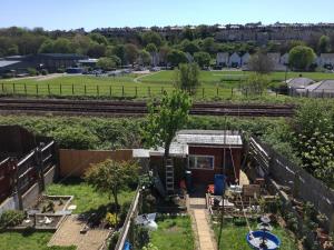 an aerial view of a yard with train tracks at Apartment with shared garden and basic equipments in Plymouth