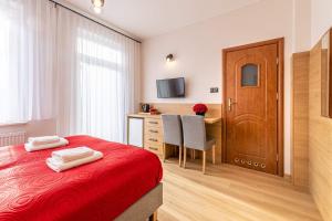 Postel nebo postele na pokoji v ubytování Dom Wypoczynkowy Rena