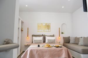 Ένα ή περισσότερα κρεβάτια σε δωμάτιο στο Theodora Luxury Studios
