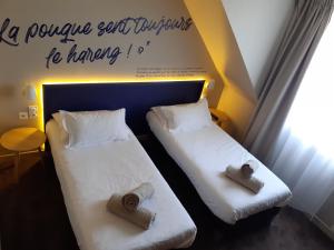 Postel nebo postele na pokoji v ubytování Hôtel Antares & Spa