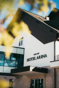 a hotel arena sign on the side of a building at Hotel Arena Maribor in Maribor