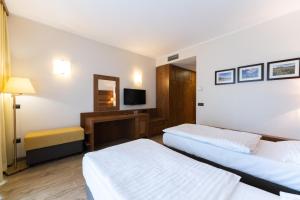 Postelja oz. postelje v sobi nastanitve Hotel Arena Maribor