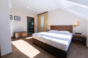 Postelja oz. postelje v sobi nastanitve Hotel Arena Maribor