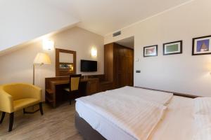 TV in/ali zabaviščno središče v nastanitvi Hotel Arena Maribor