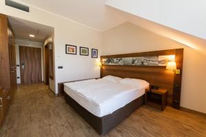 Postelja oz. postelje v sobi nastanitve Hotel Arena Maribor