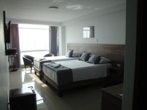 Postel nebo postele na pokoji v ubytování Hotel Terrazas Del Mar + 37 fotografií