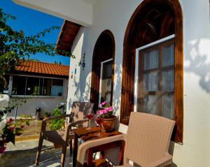 a table and chairs on the porch of a house at Casablanca Hotel in Dalyan