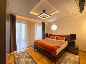 a bedroom with a bed and a large window at B&B Lovac in Ulcinj