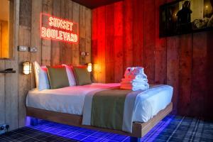 Postel nebo postele na pokoji v ubytování Briggate Hotel