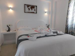 Кровать или кровати в номере Nikolas Hotel