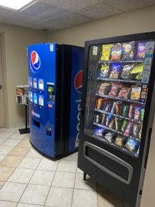 a large vending machine next to a soda machine at Red Roof Inn Sandusky - Milan in Milan