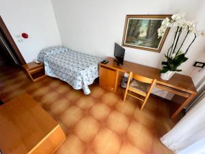 Postel nebo postele na pokoji v ubytování Hotel Ca' Bianca da Paolino