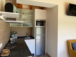 Kuchyň nebo kuchyňský kout v ubytování Apartamentos Turísticos VillaCordido Villaframil Ribadeo