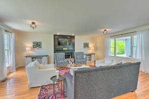 a living room with a couch and chairs at Chic Nashville-Area Retreat with Private Pool! in Kingston Springs