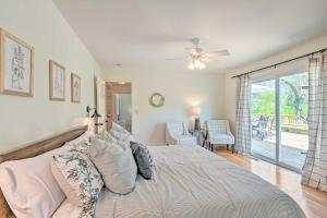 a bedroom with a bed with a ceiling fan at Chic Nashville-Area Retreat with Private Pool! in Kingston Springs +29 photos