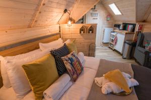 a living room with a couch in a cabin at Punch Tree Cabins Couples Outdoor Bath in Carluke