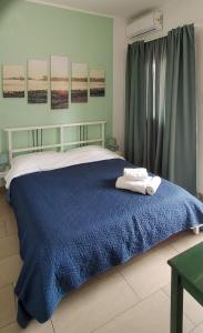 Ένα ή περισσότερα κρεβάτια σε δωμάτιο στο Villa Felice