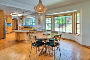 a kitchen and dining room with a table and chairs at Apple Hill Home 10 Acres with Beautiful Views! in Camino