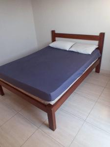 Een bed of bedden in een kamer bij Casa praia Itanhaem c piscina