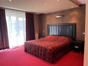 Een bed of bedden in een kamer bij Vila Srbija Beograd