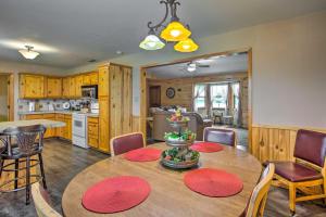 a kitchen and dining room with a table and chairs at Emory Escape with Pond Access Less Than 13 Mi to Lake! in Emory