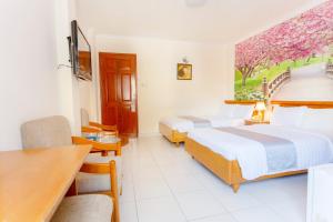 Cama o camas de una habitación en Giang Linh Hotel