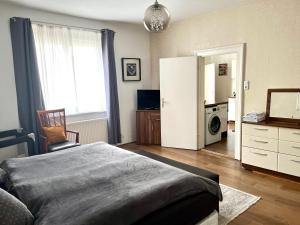 Giường trong phòng chung tại Lovely Apartment Center of Baden-Baden
