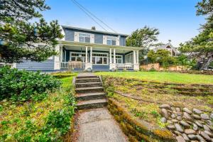 a house with a staircase leading to the front yard at Oceans Away in Seaside