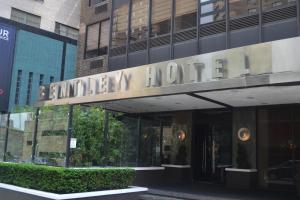 a building with a sign for the entrance to a hotel at Bentley Hotel in New York
