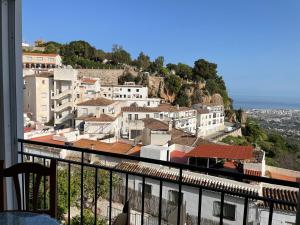 a view of a city from a balcony at EL PARAISO, Apartamento en Mijas Pueblo con bonitas vistas a la costa y con piscina in Mijas