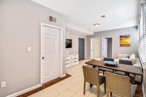a dining room and living room with a table and chairs at The Vacation spot! 2bd apartment steps away from the convention center in Philadelphia