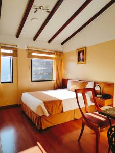 Postel nebo postele na pokoji v ubytování Hotel Carolina Montecarlo
