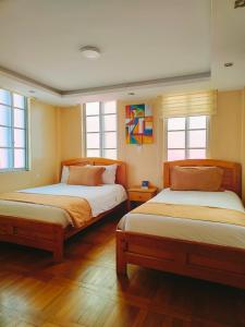 Letto o letti in una camera di Hotel Carolina Montecarlo
