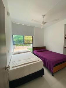 Postel nebo postele na pokoji v ubytování Casa 75 San Marcos Poblado