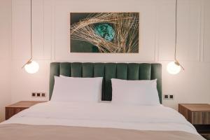 Postel nebo postele na pokoji v ubytování Orden Hotel
