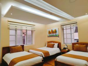 Letto o letti in una camera di Hotel Carolina Montecarlo