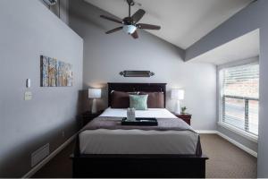 a bedroom with a bed with a ceiling fan at Inn Above Oak Creek Sedona in Sedona