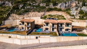 an aerial view of a house at Mani Theasis in Stoupa