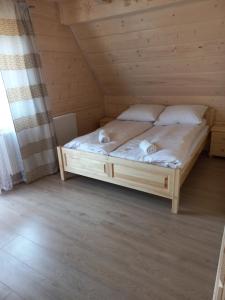 Postel nebo postele na pokoji v ubytování Domki Widokowe Panorama Tatr
