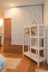 Postel nebo postele na pokoji v ubytování MURANO Place - RIVA - Duplex
