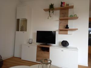 TV a/nebo společenská místnost v ubytování Nordseemole