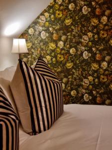 A bed or beds in a room at Abhaig Boutique B&B - Small & luxurious in a great location!